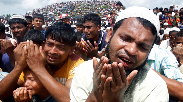 FILE PHOTO: Rohingya refugees pray at a gathering mark the second anniversary of their exodus from Myanmar, at the Kutupalong camp in Cox’s Bazar, Bangladesh, August 25, 2019. REUTERS/Rafiqur Rahman/File Photo

