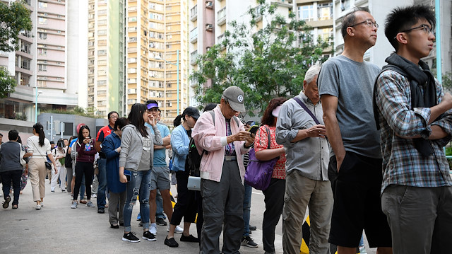 People line up to vote in district council elections in South Horizons in Hong Kong, China November 23, 2019