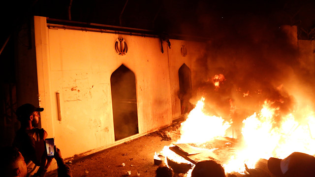 Demonstrators set fire in front of the Iranian consulate, as they gather during ongoing anti-government protests in Najaf, Iraq November 27, 2019. REUTERS/Stringer NO RESALES. NO ARCHIVES

