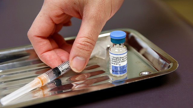 FILE PHOTO: A vial of the measles, mumps, and rubella virus (MMR) vaccine is pictured at the International Community Health Services clinic in Seattle, Washington, U.S., March 20, 2019. 