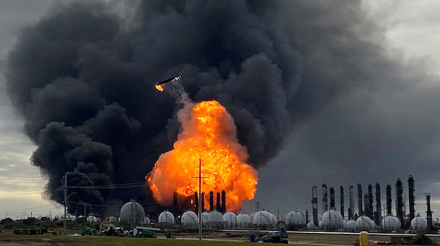 A process tower flies through air after exploding at the TPC Group Petrochemical Plant, after an earlier massive explosion sparked a blaze at the plant in Port Neches, Texas, U.S., November 27, 2019