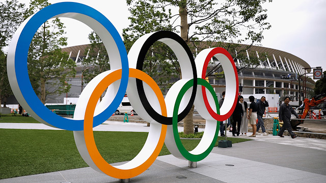 Olympic rings are displayed in front of the construction site of the New National Stadium, the main stadium of Tokyo 2020 Olympics and Paralympics, during a media opportunity in Tokyo, Japan July 3, 2019.