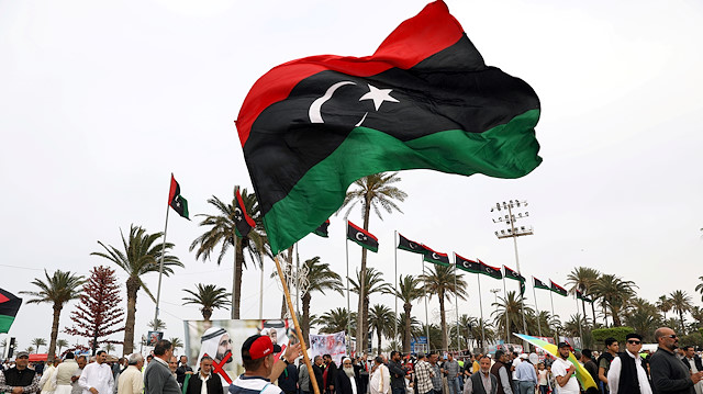  Libyan man waves a Libyan flag 