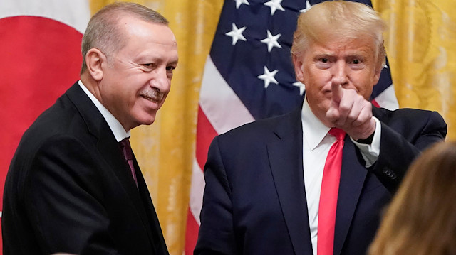 U.S. President Donald Trump greets Turkey's President Tayyip Erdoğan