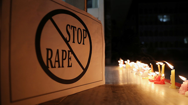 A poster is seen at a candle-lit march by the resident doctors and medical students from All India Institute Of Medical Sciences (AIIMS) to protest against the alleged rape and murder of a 27-year-old woman on the outskirts of Hyderabad, in New Delhi, India, December 3, 2019. REUTERS/Anushree Fadnavis

