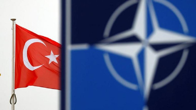 FILE PHOTO: A Turkish flag flies next to NATO logo at the Alliance headquarters in Brussels, Belgium, November 26, 2019. REUTERS/Francois Lenoir -CopyrightFRANCOIS LENOIR(Reuters) 