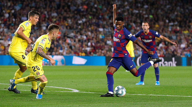 FILE PHOTO: Soccer Football - La Liga Santander - FC Barcelona v Villarreal - Camp Nou, Barcelona, Spain - September 24, 2019 Barcelona's Ansu Fati in action with Villarreal's Ruben 