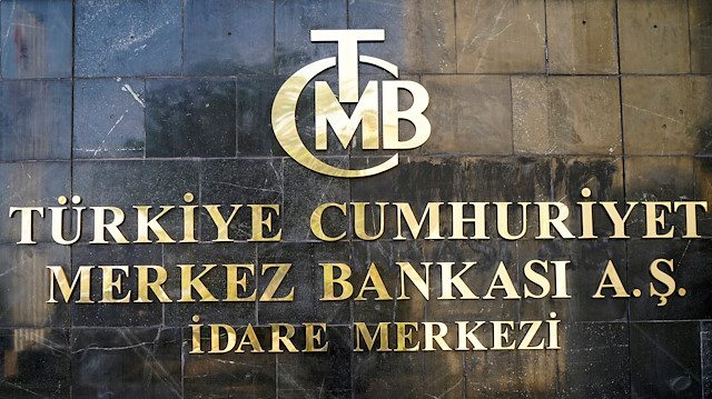 FILE PHOTO: A logo of Turkey's Central Bank (TCMB) is pictured at the entrance of the bank's headquarters in Ankara, Turkey April 19, 2015. REUTERS/Umit Bektas/File Photo

