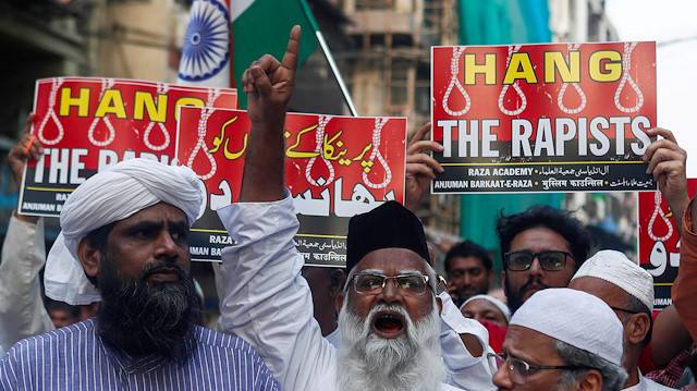 FILE PHOTO: File photo of demonstrators in Mumbai, India holding placards and shouting slogans during a protest against the alleged rape and murder of a 27-year-old veterinarian on the outskirts of Hyderabad. Four men suspected of the crime were shot dead by police on Friday. Photo taken on December 3, 2019. REUTERS/Francis Mascarenhas/File Photo

