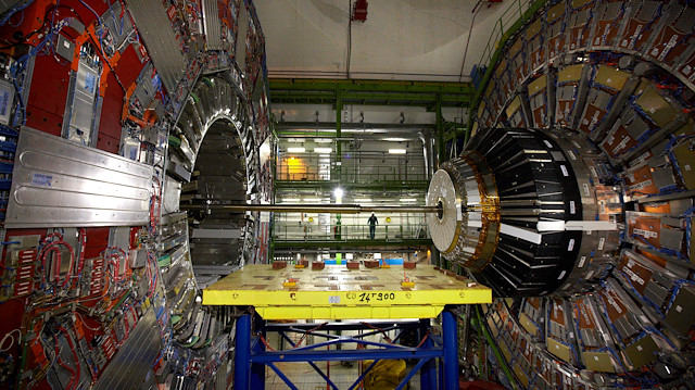 A technician stands near equipment of the Compact Muon Solenoid (CMS) experience at the Organization for Nuclear Research (CERN) in the French village of Cessy, France, near Geneva in Switzerland April 15, 2013. To match Interview SCIENCE-CERN/ REUTERS/Denis Balibouse/File Photo

