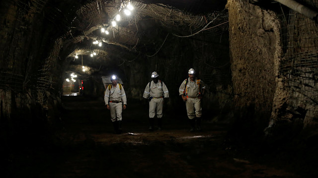 FILE PHOTO: Workers are seen underground at Gold Fields South Deep mine in Westonaria, 45 kilometres south-west of Johannesburg, March 9, 2017. REUTERS/Siphiwe Sibeko/File Photo

