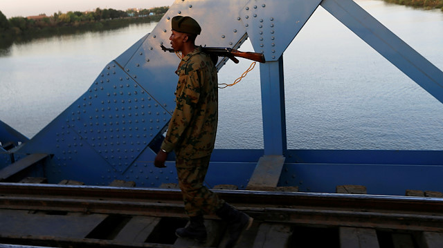 A Sudanese soldier walks past a bridge over the Blue Nile during a sit-in protest outside the Defence Ministry in Khartoum, Sudan April 15, 2019. REUTERS/Mohamed Nureldin Abdallah

