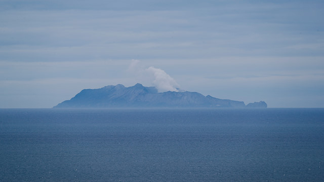 A general view of the Whakaari, also known as White Island volcano, as seen from Ohope beach in Whakatane, New Zealand, December 11, 2019. 