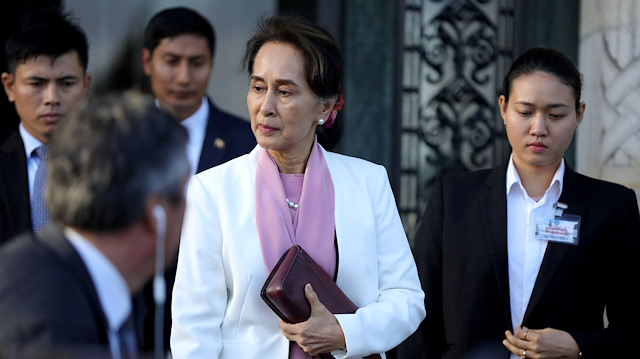 Myanmar's leader Aung San Suu Kyi leaves the International Court of Justice (ICJ), 