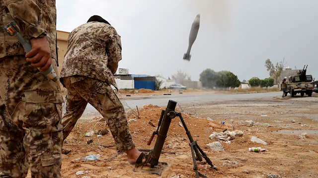  A fighter loyal to Libya's U.N.-backed government (GNA) fires a mortar 
