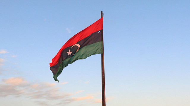 A Libyan flag flies