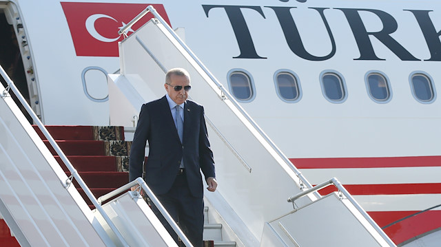 Turkish President Tayyip Erdogan leaves his plane 