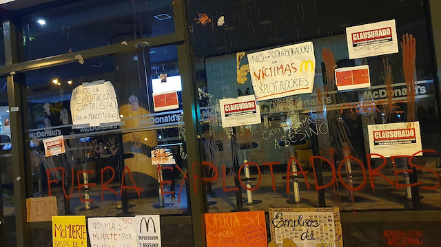 Protest signs are seen outside of a closed McDonald's restaurant, in Miraflores near Lima, Peru December 17, 2019 in this picture obtained from social media.