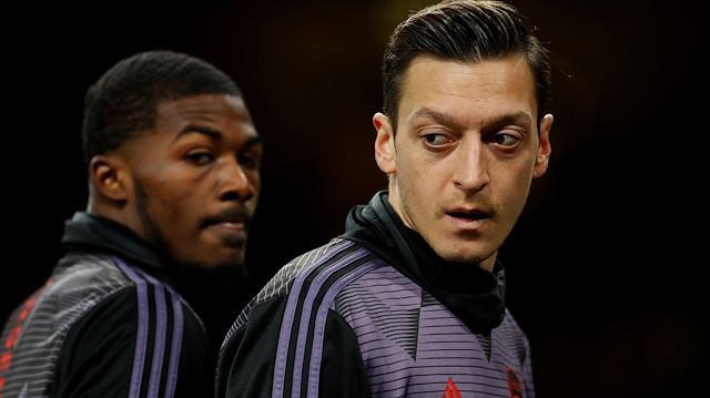 FILE PHOTO: Soccer Football - Premier League - Arsenal v Manchester City - Emirates Stadium, London, Britain - December 15, 2019 Arsenal's Mesut Ozil and Ainsley Maitland-Niles during the warm up before the match Action Images via Reuters/John Sibley EDITORIAL USE ONLY. No use with unauthorized audio, video, data, fixture lists, club/league logos or "live" services. Online in-match use limited to 75 images, no video emulation. No use in betting, games or single club/league/player publications. Please contact your account representative for further details./File Photo

