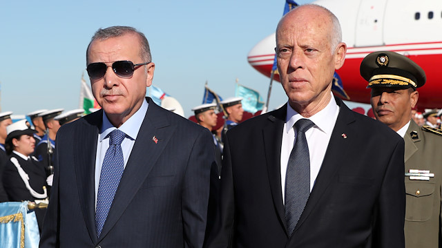Turkey's President Tayyip Erdogan is welcomed by Tunisia's President Kais Saied at the airport in Tunis, Tunisia, December 25, 2019. Murat Cetinmuhurdar/Turkish Presidential Press Office/Handout via REUTERS ATTENTION EDITORS - THIS PICTURE WAS PROVIDED BY A THIRD PARTY. NO RESALES. NO ARCHIVE

