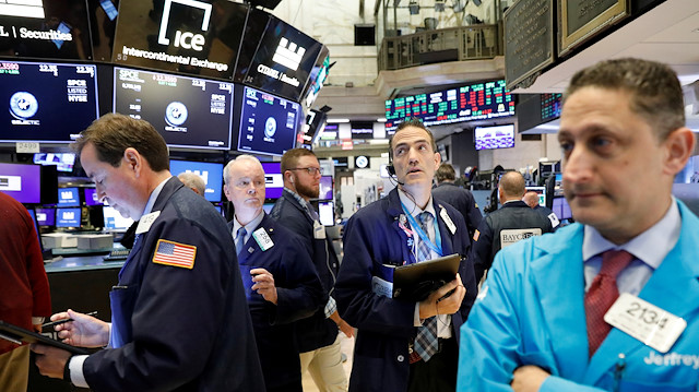 File photo:  Traders work on the floor at the New York Stock Exchange (NYSE) in New York
