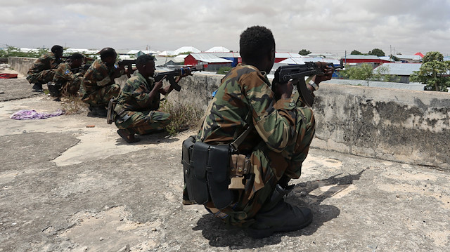 Members of Somali Armed Forces take their position during fighting between the military and police backed by intelligence forces in the Dayniile district of Mogadishu, Somalia September 16, 2017. REUTERS/Feisal Omar

