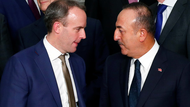 British Foreign Minister Dominic Raab talks to Turkish Foreign Minister Mevlut Cavusoglu 