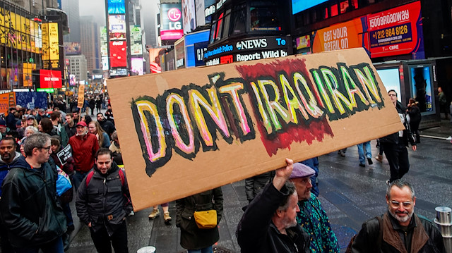 People march as they take part in an anti-war protest amid increased tensions between the United States and Iran at Times Square in New York, U.S., January 4, 2020. REUTERS/Eduardo Munoz

