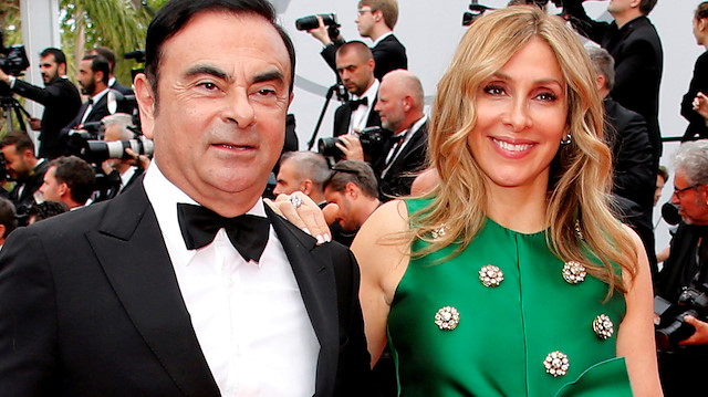 FILE PHOTO: 70th Cannes Film Festival – Screening of the film "L'Amant double" (Amant Double) in competition - Red Carpet Arrivals - Cannes, France. 26/05/2017. Carlos Ghosn, Chairman and CEO of the Renault-Nissan Alliance, and his wife Carole pose. Picture taken May 26, 2017. REUTERS/Jean-Paul Pelissier/File Photo

