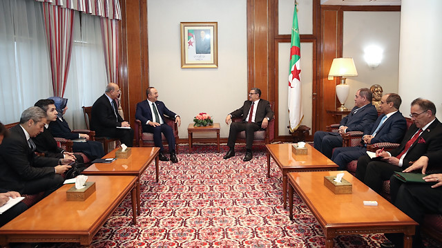  Turkish Foreign Minister Mevlut Cavusoglu (R) meets Prime Minister of Algeria Abdelaziz Djerad (L) in Algiers, Algeria on January 7, 2020.