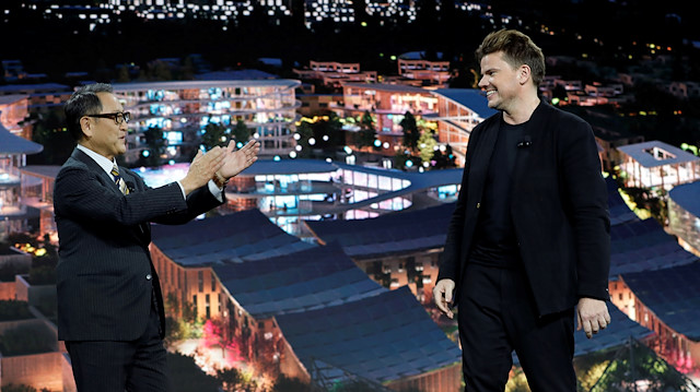 Akio Toyoda (L), president of Toyota Motor Corporation, applauds Danish architect Bjarke Ingels, CEO of Bjarke Ingels Group, at a news conference where Toyota announced plans to build a prototype city of the future on a 175-acre site at the base of Mt. Fuji in Japan, during the 2020 CES in Las Vegas, Nevada, U.S. January 6, 2020
