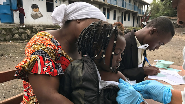 File photo: Health workers vaccinate a girl against measles at a school in eastern Congolese town of Goma, Democratic Republic of Congo, December 11, 2019.