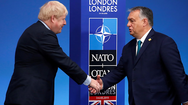 Britain's Prime Minister Boris Johnson welcomes Hungary's Prime Minister Viktor Orban at the NATO leaders summit in Watford, Britain December 4, 2019. REUTERS/Christian Hartmann/Pool

