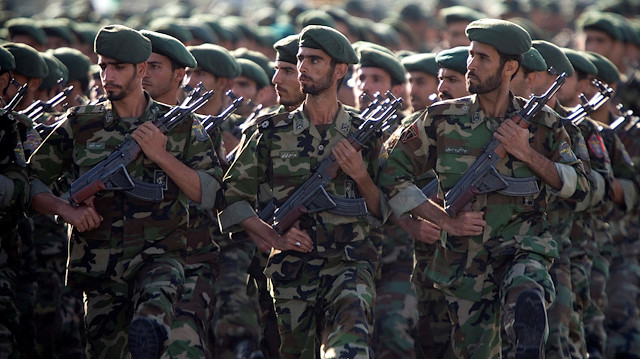 Members of Iran's Revolutionary Guards march during a military parade