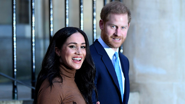 FILE PHOTO: Britain's Prince Harry and his wife Meghan, Duchess of Sussex react as they leave after their visit to Canada House in London, Britain January 7, 2020. 