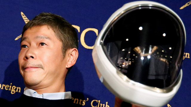 FILE PHOTO: Japanese billionaire Yusaku Maezawa, founder and chief executive of online fashion retailer Zozo, who has been chosen as the first private passenger by SpaceX, poses for photos as he attends a news conference at the Foreign Correspondents' Club of Japan in Tokyo, Japan, October 9, 2018. REUTERS/Toru Hanai/File Photo

