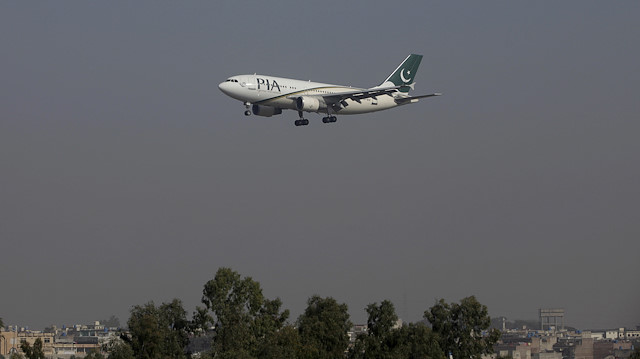 FILE PHOTO: A Pakistan International Airlines (PIA) passenger plane arrives at the Benazir International airport in Islamabad, Pakistan, December 2, 2015. REUTERS/Faisal Mahmood/File Photo

