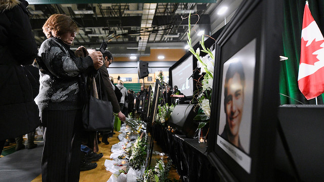 Flowers and photos of the victims set up at a memorial service 