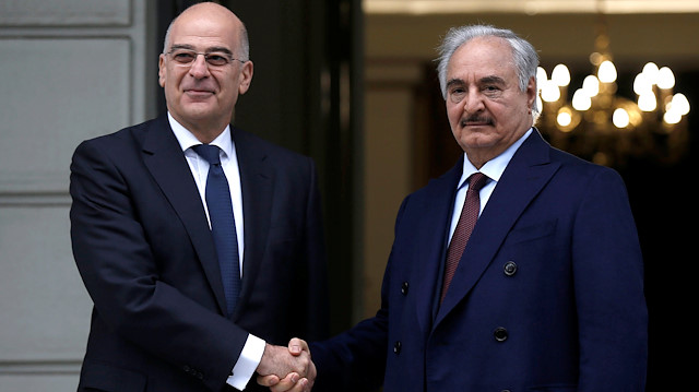 Greek Foreign Minister Nikos Dendias welcomes Libya's commander Khalifa Haftar at the Foreign Ministry in Athens, Greece, January 17, 2020. REUTERS/Costas Baltas

