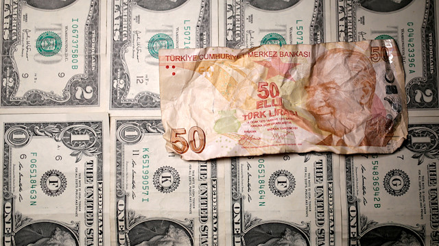 FILE PHOTO: Turkish lira and U.S. dollar banknotes are seen in this picture illustration taken August 19, 2018. REUTERS/Dado Ruvic/Illustration -/File Photo

