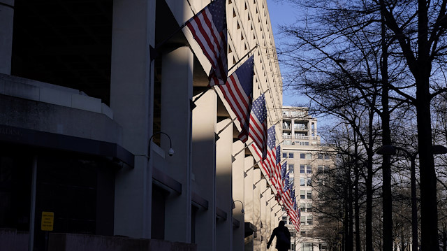A pedestrian walks past the headquarters of the Federal Bureau of Investigation (FBI) 