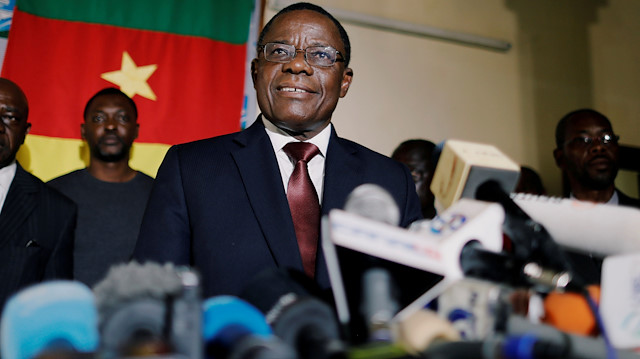 FILE PHOTO: Maurice Kamto, a presidential candidate of Renaissance Movement (MRC), smiles as he holds a news conference at his headquarter in Yaounde, Cameroon October 8, 2018. REUTERS/Zohra Bensemra/File Photo

