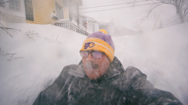 A man is pictured in a snowy street in St. John's, Newfoundland and Labrador, Canada January 17, 2020. 