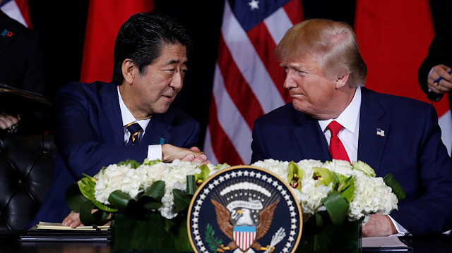 File photo: Japan's Prime Minister Shinzo Abe shakes hands with U.S. President Donald Trump 