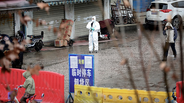 File photo: A worker in a protective suit is seen at the closed seafood market in Wuhan, Hubei province, China January 10, 2020. The seafood market is linked to the outbreak of the pneumonia caused by the new strain of coronavirus, but some patients diagnosed with the new coronavirus deny exposure to this market. Picture taken January 10, 2020