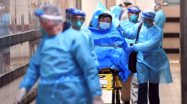 Medical staff transfer a patient of a highly suspected case of a new coronavirus at the Queen Elizabeth Hospital in Hong Kong, China January 22, 2020. Picture taken January 22, 2020.