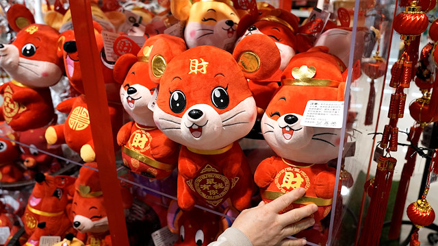 File photo: A woman selects upcoming Lunar New Year of the Rat decorations 