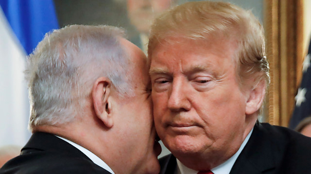 FILE PHOTO: Israel's Prime Minister Benjamin Netanyahu talks with U.S. President Donald Trump during their meetings at the White House in Washington, U.S., March 25, 2019. REUTERS/Carlos Barria/File Photo

