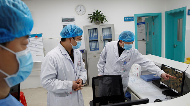 File photo: Doctors look at a screen that shows the ward where patients who are infected with the coronavirus are treated at the First People's Hospital in Yueyang, Hunan Province, near the border to Hubei Province, which is under partial lockdown after an outbreak of a new coronavirus, in China January 28, 2020