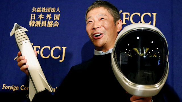 FILE PHOTO: Japanese billionaire Yusaku Maezawa, who has been chosen as the first private passenger by SpaceX, poses for photos as he attends a news conference at the Foreign Correspondents' Club of Japan in Tokyo, Japan, October 9, 2018. REUTERS/Toru Hanai/File Photo

